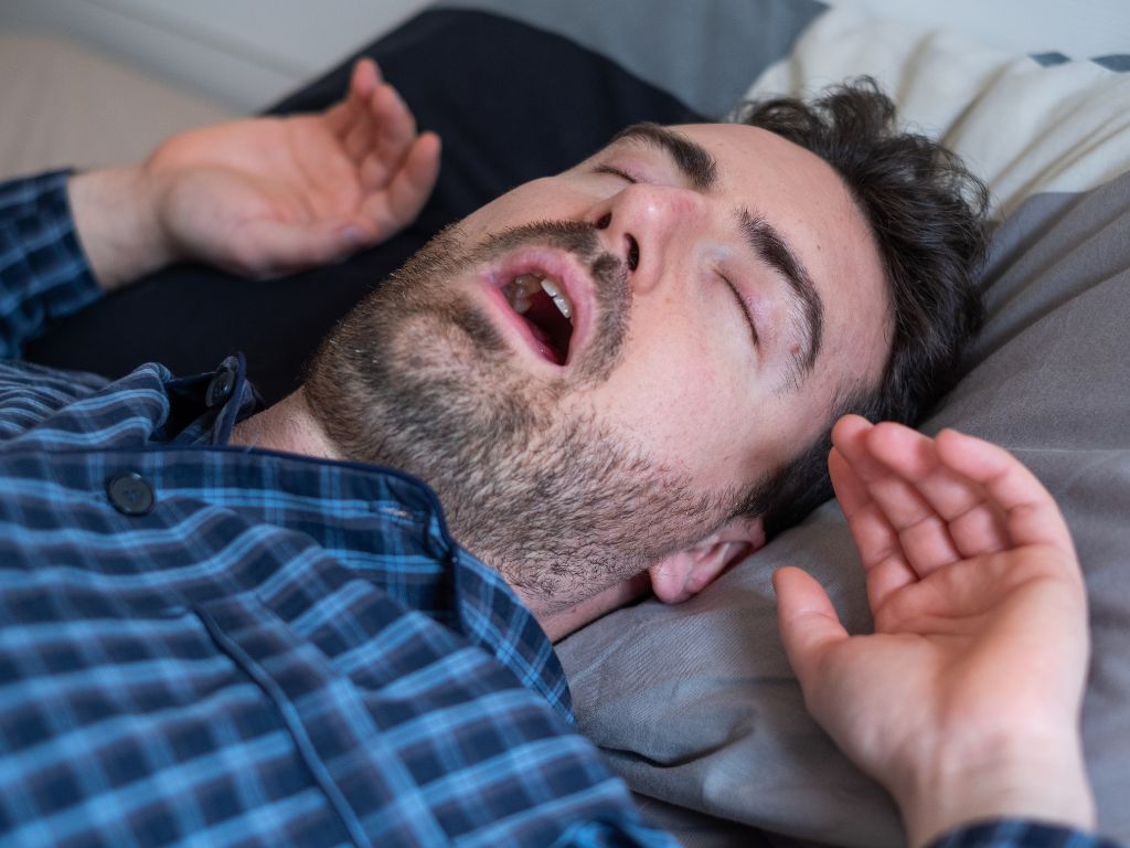man asleep with mouth open